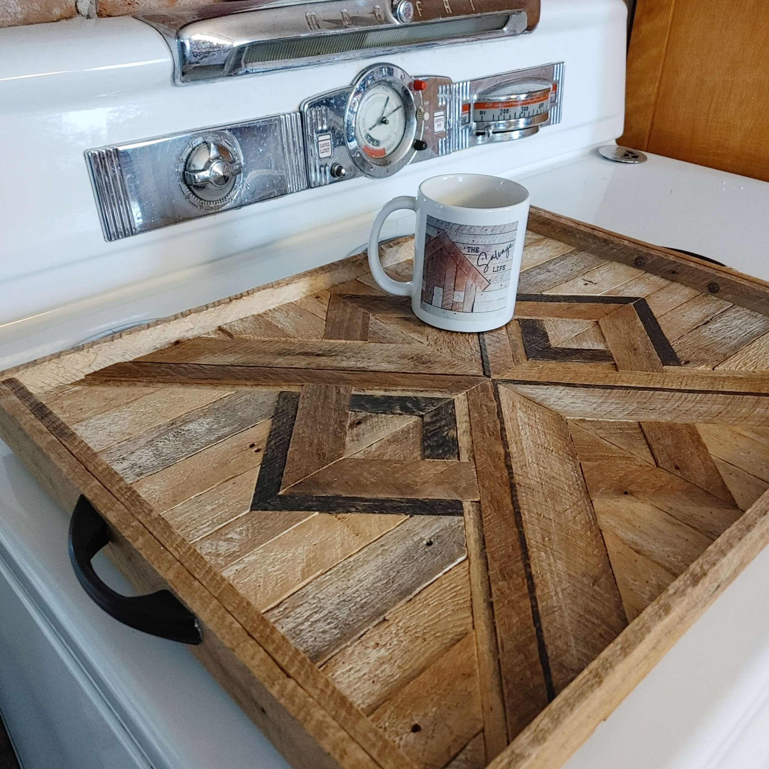 Tray made from reclaimed wood on a white stove